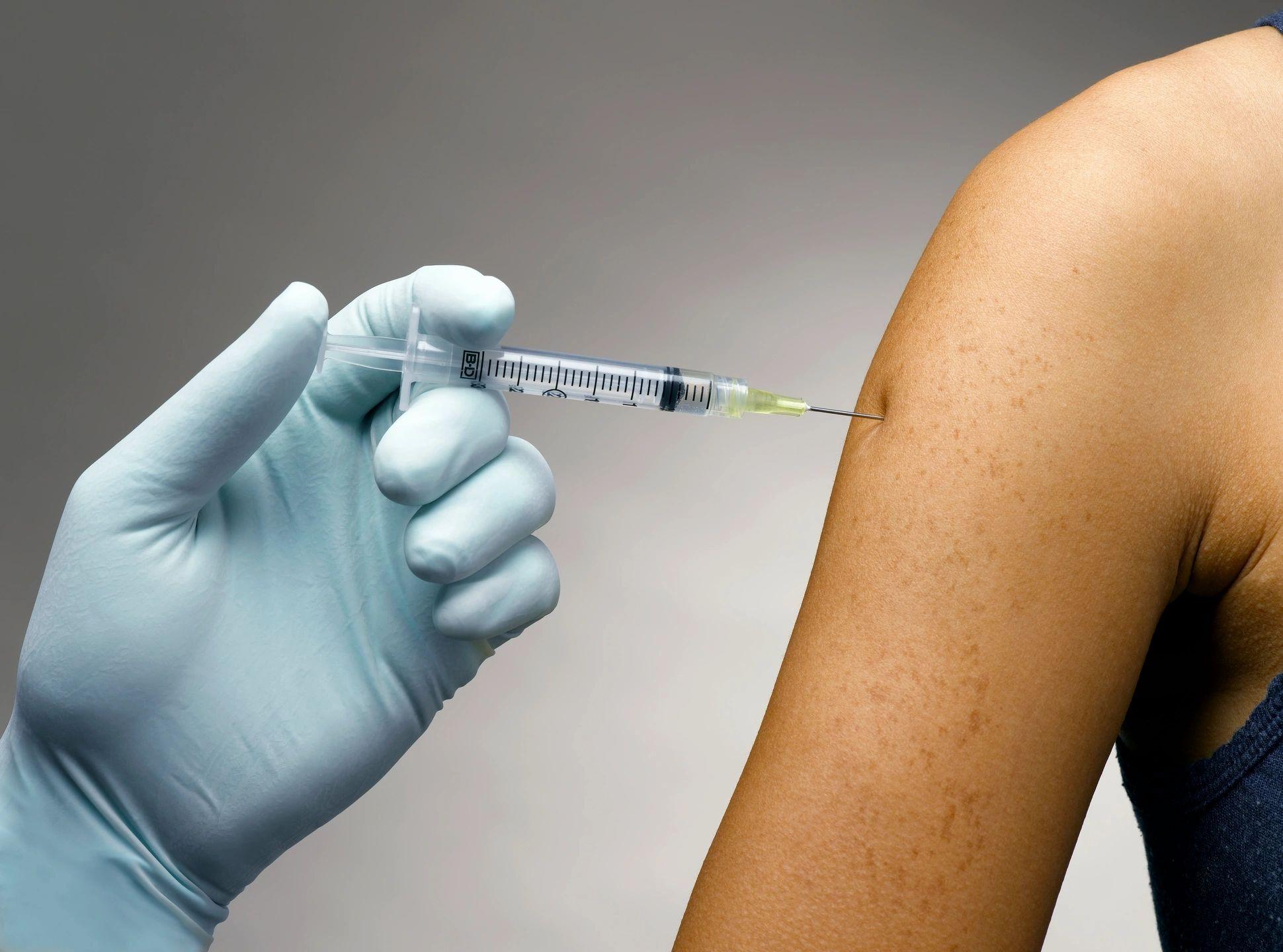 Provider preparing an injection for wellness treatment